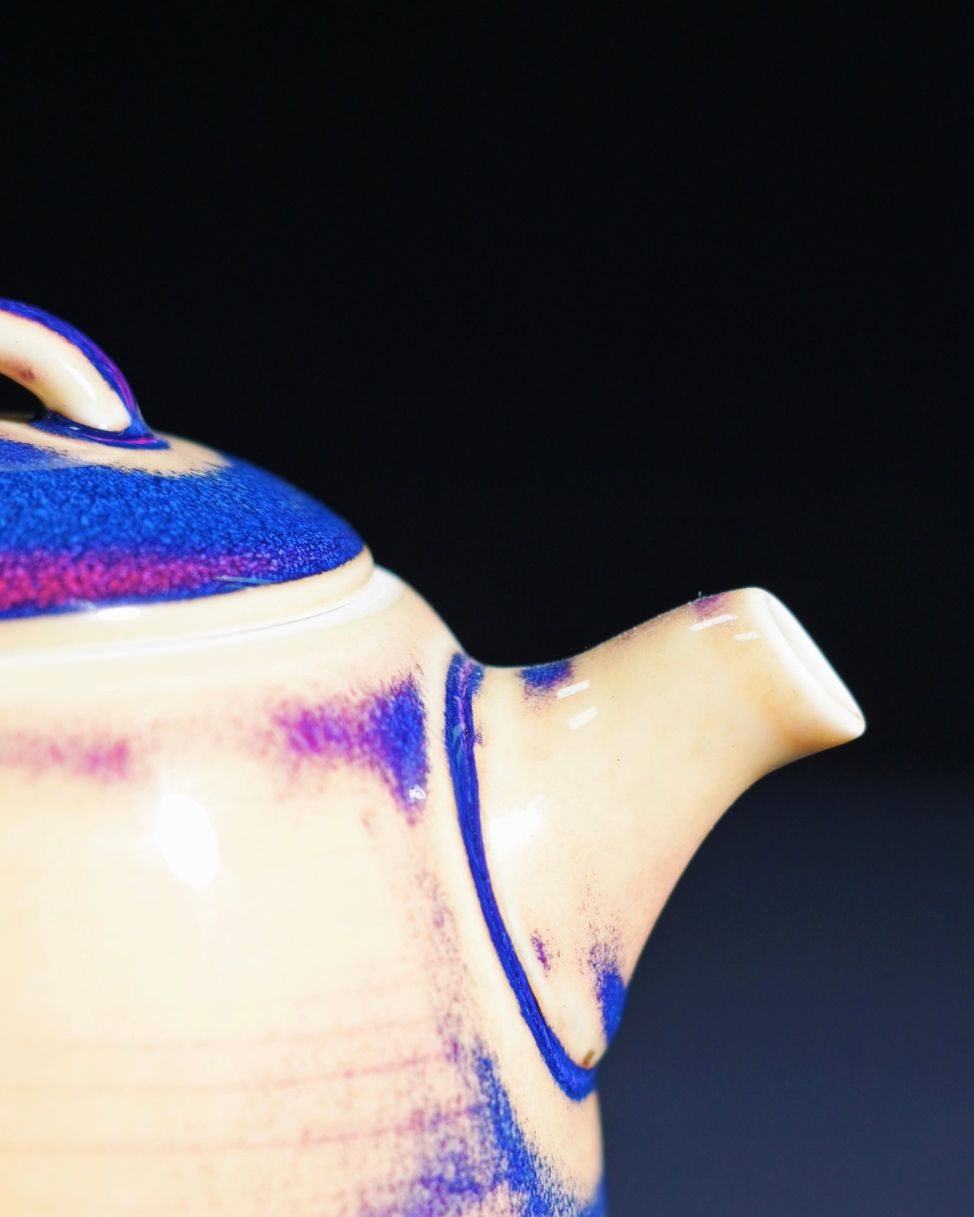 Detail of Jun porcelain glaze showing blue purple and beige kiln transformation