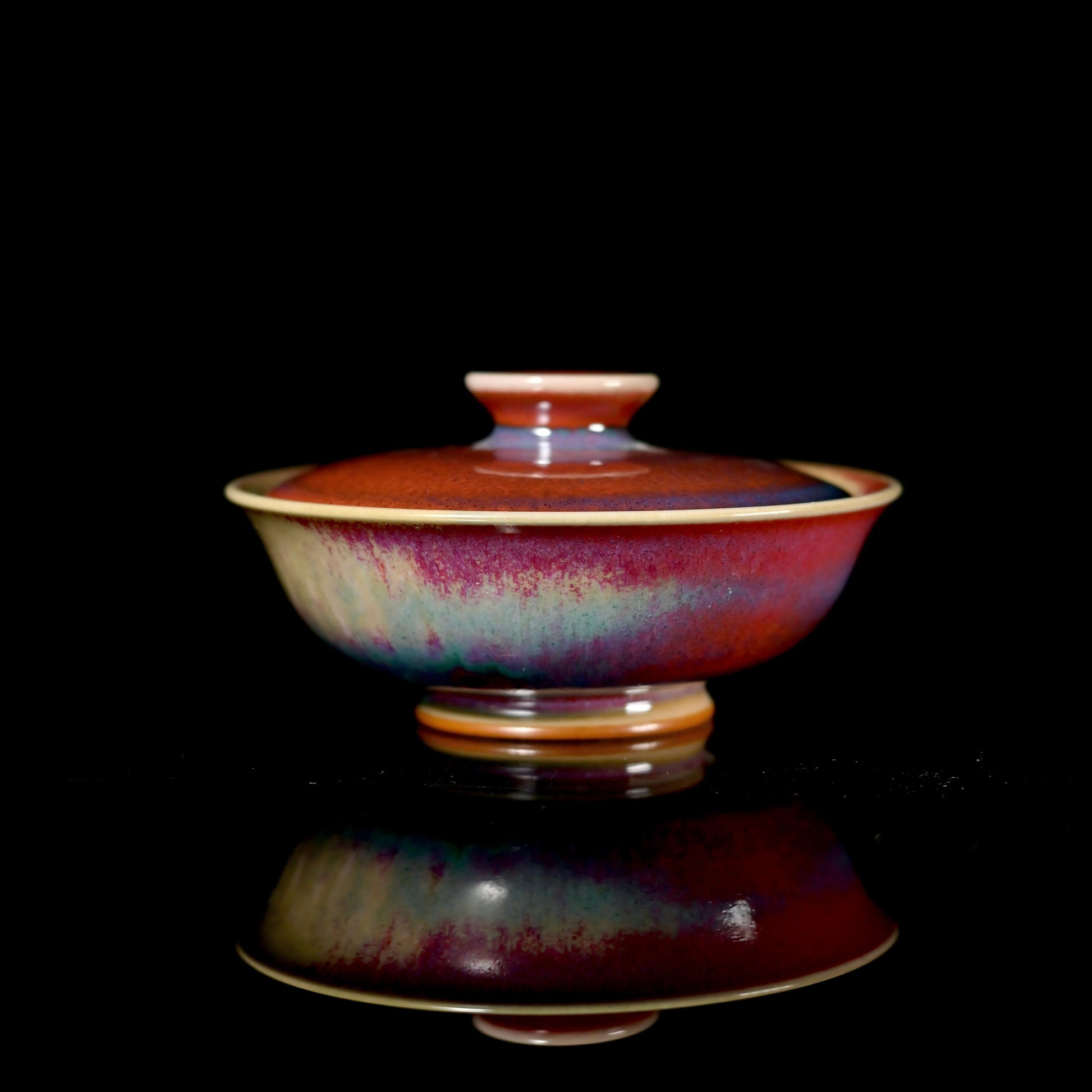 Jun ware wide-rim gaiwan with kiln-transformed red, purple, and blue glaze