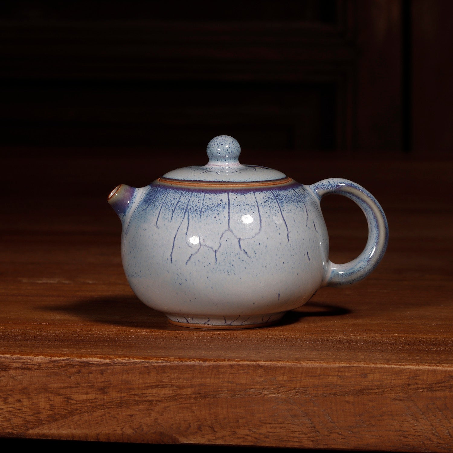 100ml Jun kiln Xishi teapot, ideal capacity for solo Gongfu tea brewing sessions.