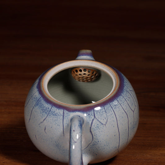 Traditional rounded Xishi shape teapot made of handcrafted Jun ware celadon with fine crackle.