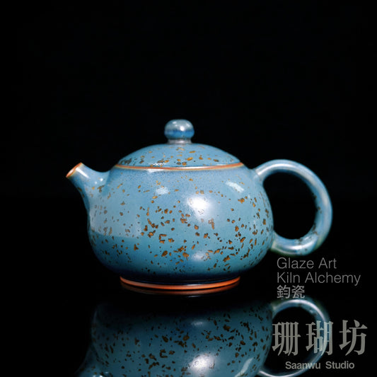 Jun ware Xishi teapot featuring pine-green kiln-transformed glaze with carbon-crystallized star speckling