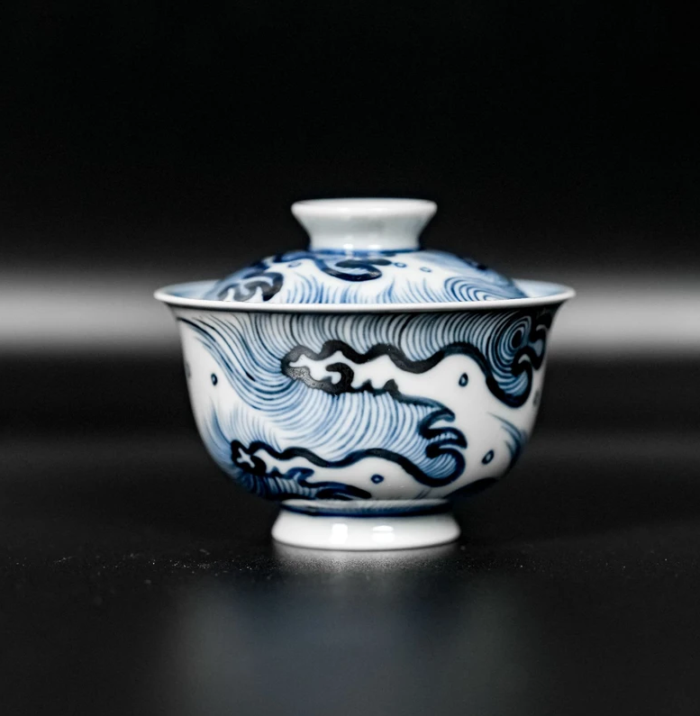 Fine kaolin porcelain tea vessel combining material purity with classic decorative painting