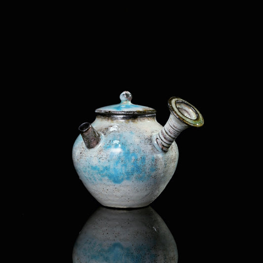 Kohiki soda-fired side-handle teapot with natural blue and pink kiln-transformed glaze on exterior