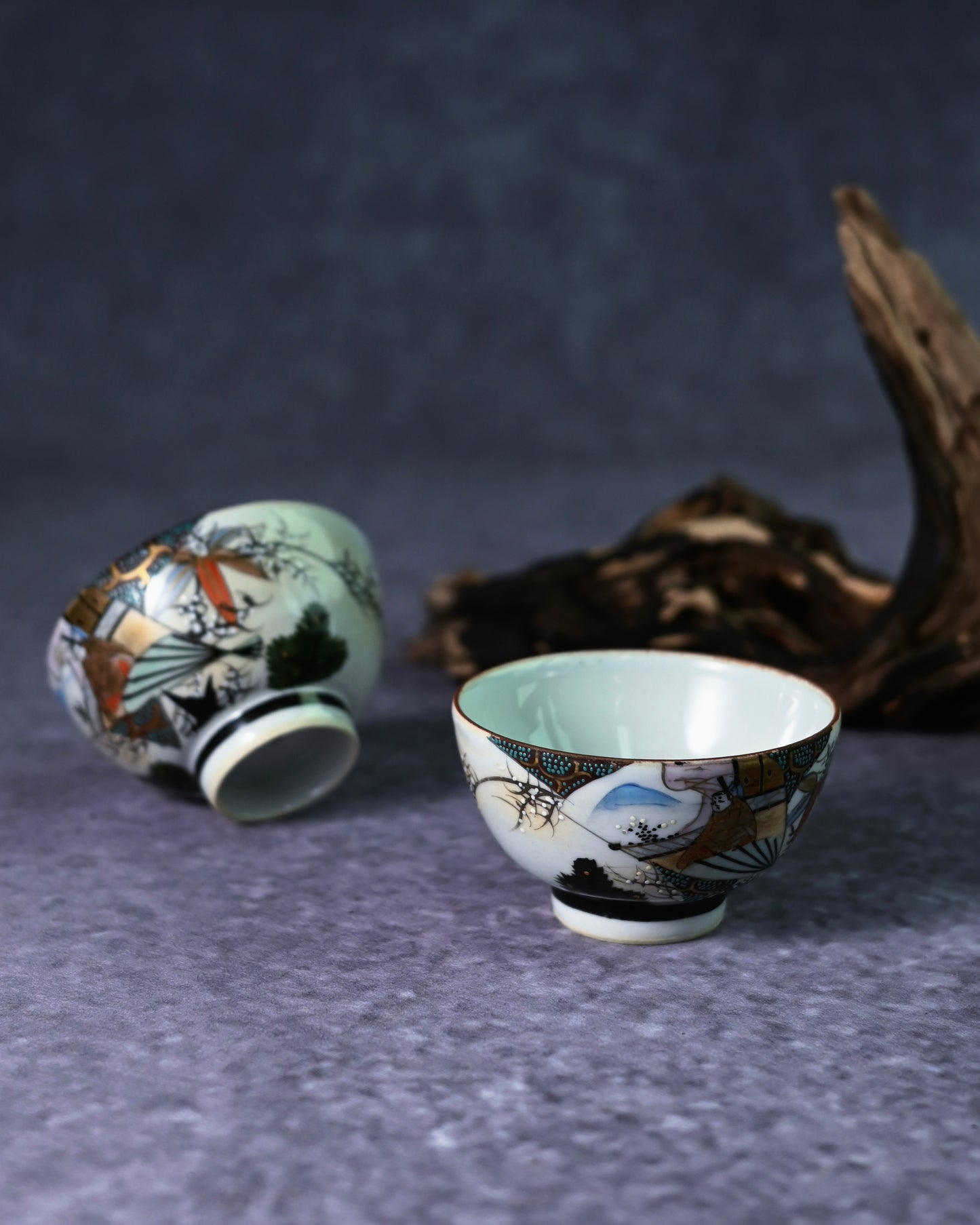  gold overglaze enamel on a Kutani cup, highlighting the intricate Kinrande style of the Meiji-Taishō period.