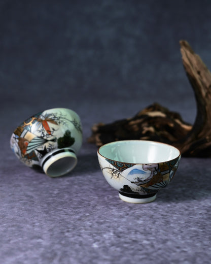  gold overglaze enamel on a Kutani cup, highlighting the intricate Kinrande style of the Meiji-Taishō period.