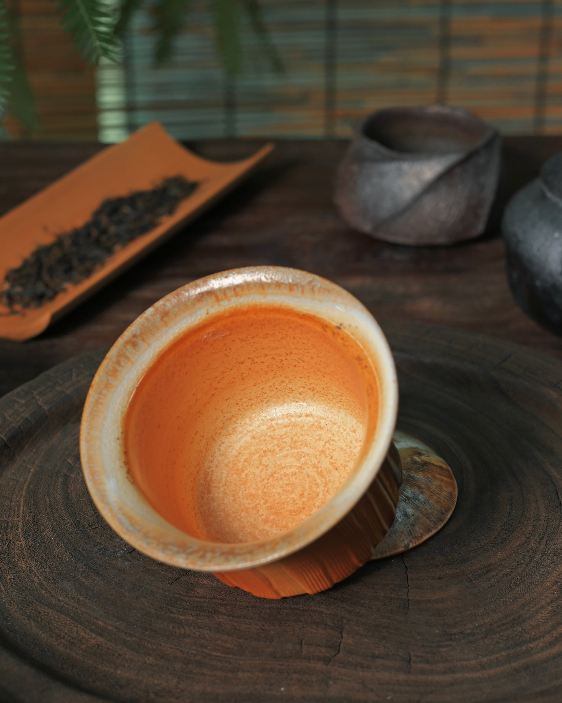 Linear textured ceramic surface created through traditional hand-carving technique