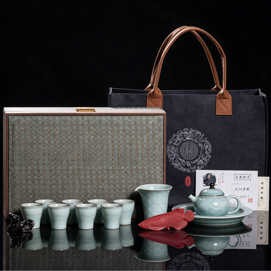 Flagship Longquan Celadon Auspicious Dragon 12-piece luxury tea set displayed with silk-lined brocade gift trunk