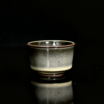 1-of-1 Longquan "Ge" kiln 120ml iron-clay teacup with deep moss green gradient and metallic bronze rim
