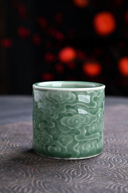 Inspired by nature’s calm—Longquan Celadon Cup with embossed cloud patterns.