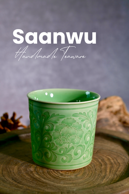 Longquan Celadon Peony Relief Cup set on a wooden tray for tea or coffee moments.