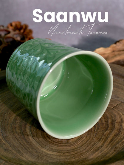 Top-down view highlighting the smooth glazed rim and glossy interior of the Longquan Celadon cup.