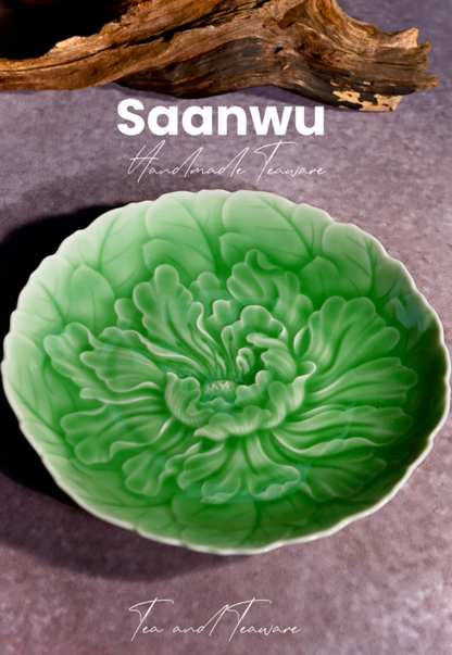 Top-down detail shot focusing on the central peony stamen and carved petal textures of the saucer