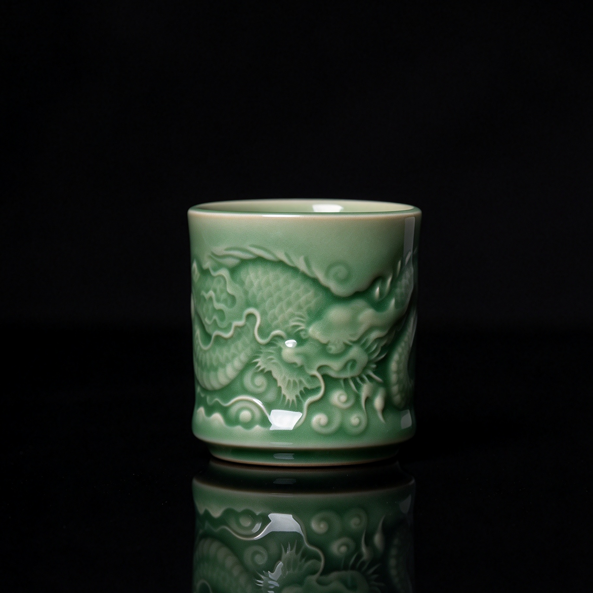 Longquan Celadon imperial dragon embossed relief teacup with jade green glaze resting on wooden block