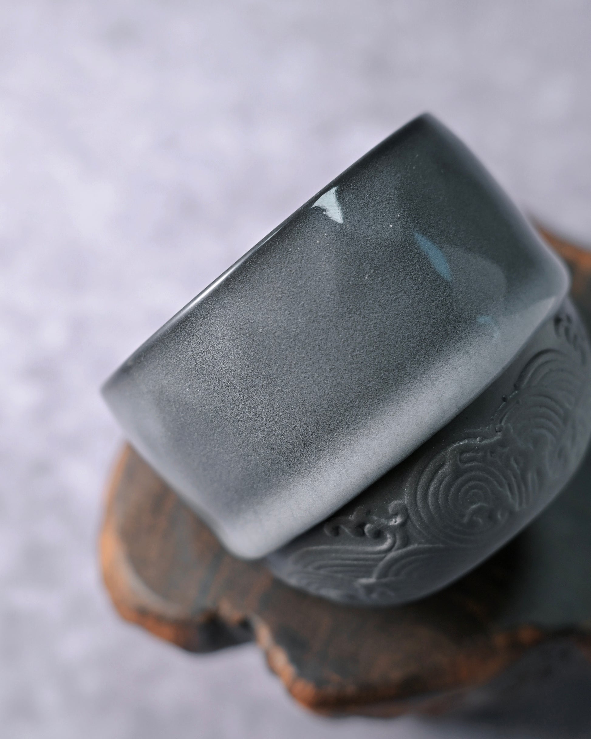 Longquan celadon minimalist cup combining substantial glaze with exposed clay detailing
