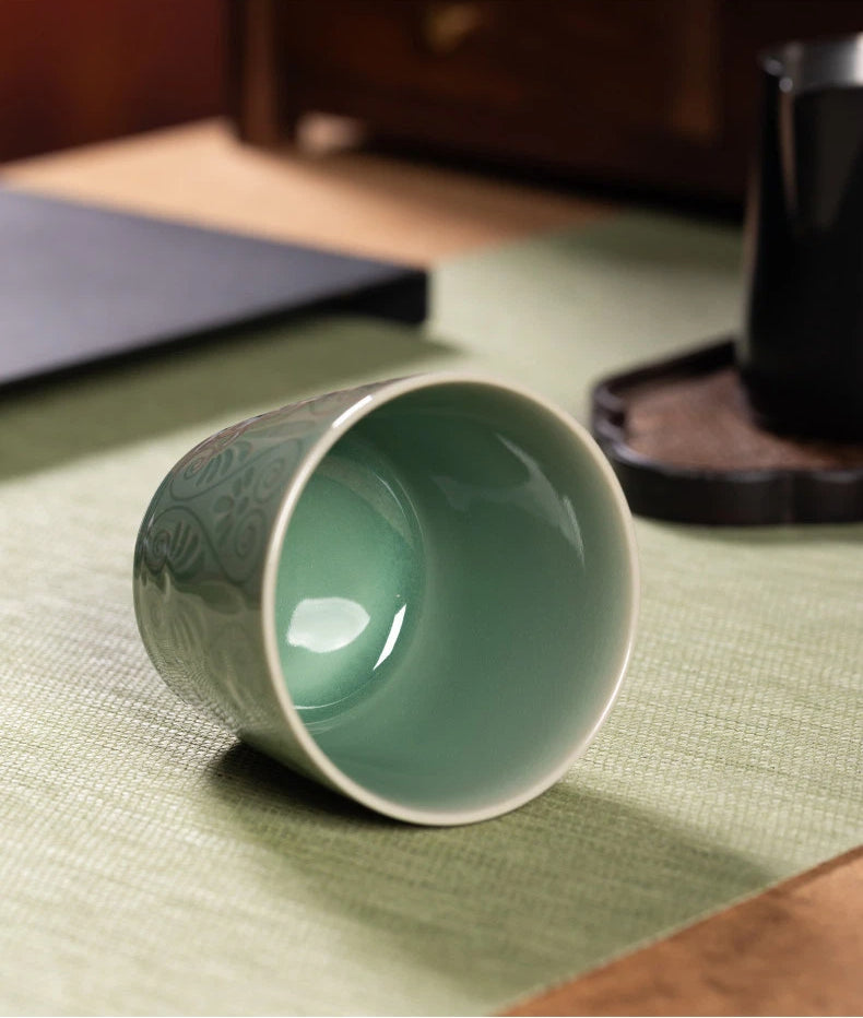 Top-down view highlighting the smooth glazed rim and glossy interior of the Longquan Celadon cup.