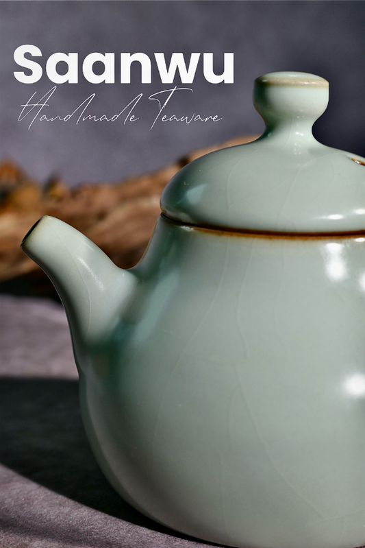 Detail shot of the teapot spout and handle on a handcrafted Longquan Celadon pear-shaped teapot.