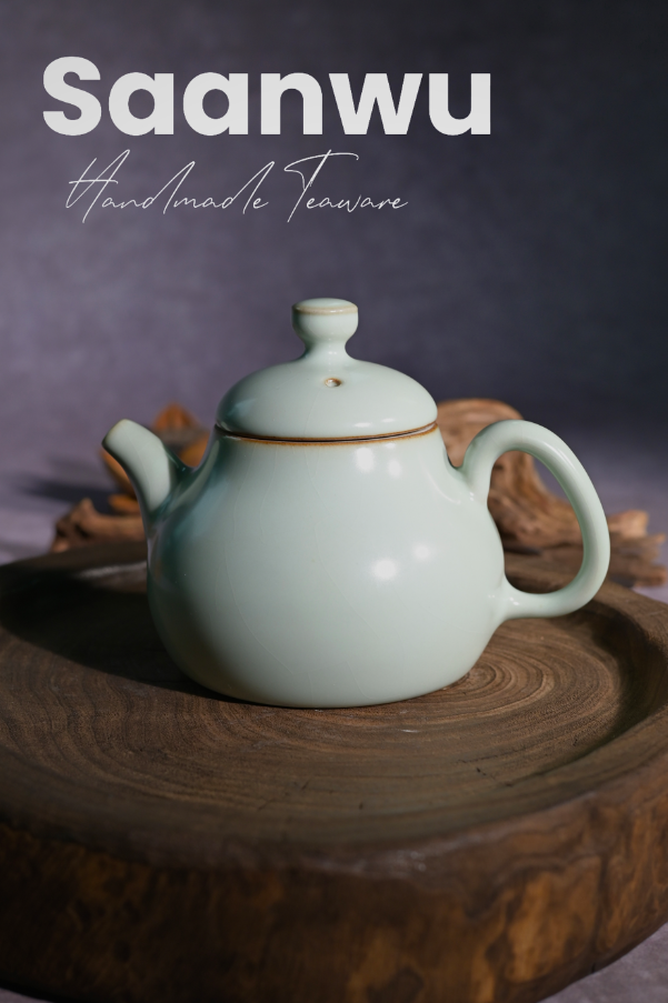 Longquan Celadon Powder Green Glaze Crackle Pear-Shaped Teapot in a front studio shot.
