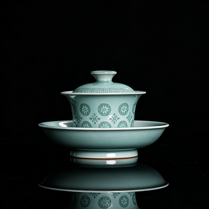 Handcrafted Longquan celadon 180ml gaiwan in powder green glaze with translucent pierced floral Linglong motif