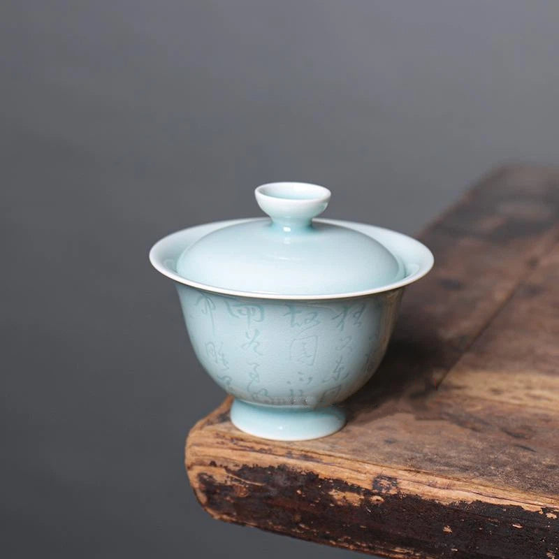 Exploded view of the Longquan Celadon Calligraphy Gaiwan showing lid, bowl, and matching saucer.