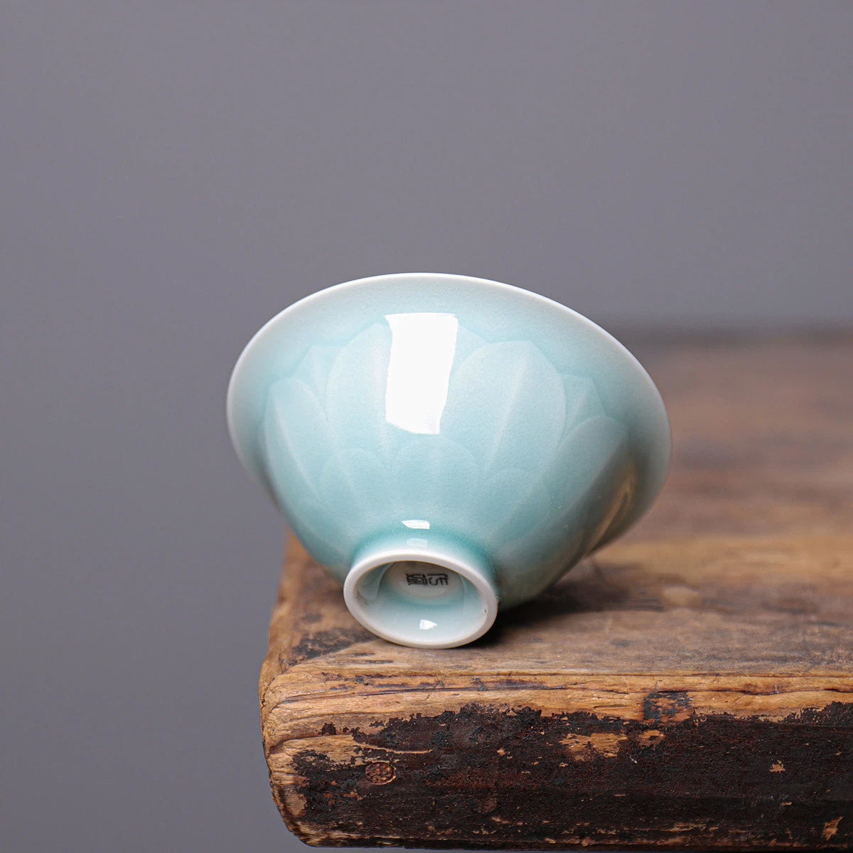 Bottom view showing the neat foot ring and artisan craftsmanship of the Longquan Celadon cup.