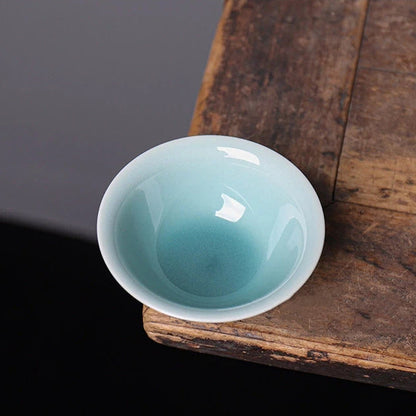 Top-down view of the smooth glazed interior and lotus-shaped rim of the Longquan Celadon cup.