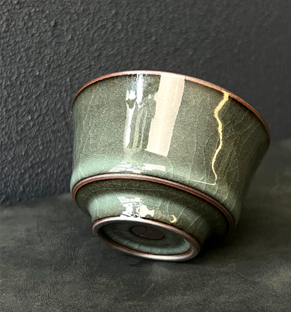 Longquan Ge kiln-style tea set including cup and fairness cup in iron-tone celadon.