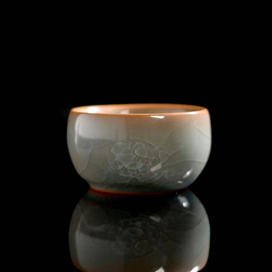 Longquan Celadon Ice-Crackle Master Cup front view showing its classic form and sea-green glaze