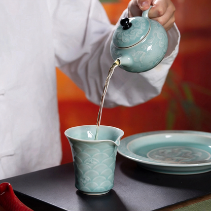 Saanwu brand executive Longquan Celadon tea collection illuminated by warm ambient lighting on a minimalist tea table
