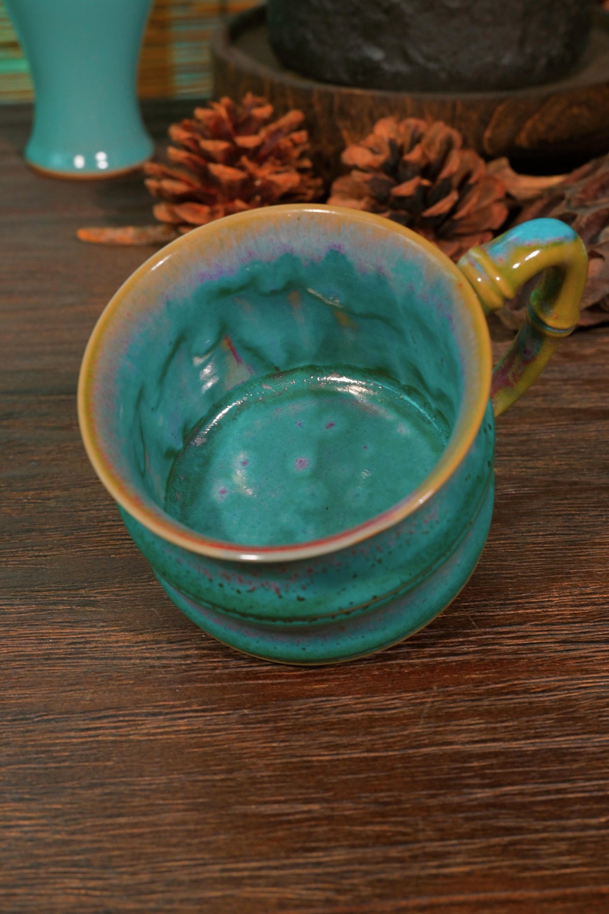 Hand-thrown bamboo-shaped stoneware mug with peacock glaze for daily tea and coffee rituals