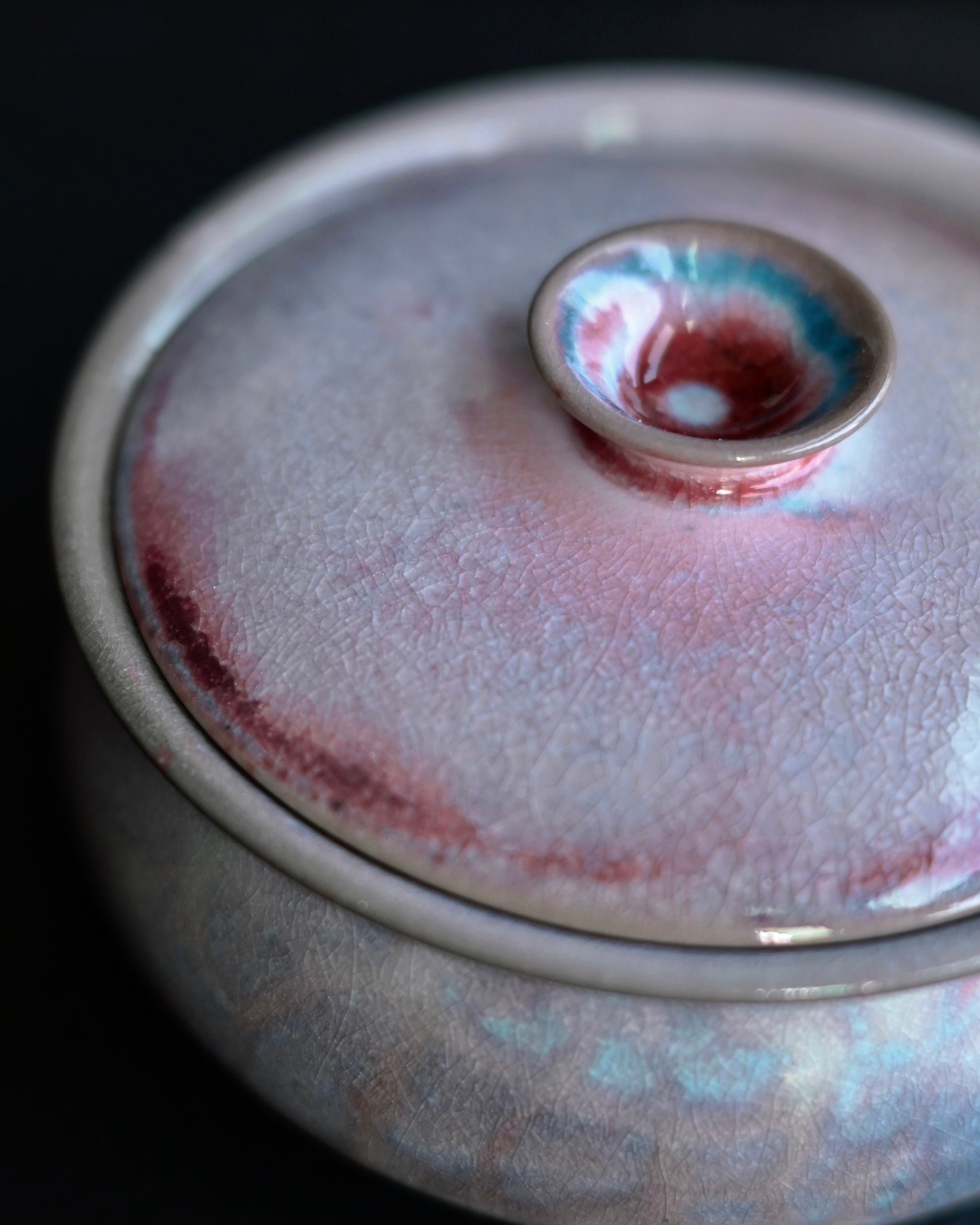 Saanwu Studio Gaiwan with vibrant glaze variations featuring pink, blue and gray tones from mineral reactions