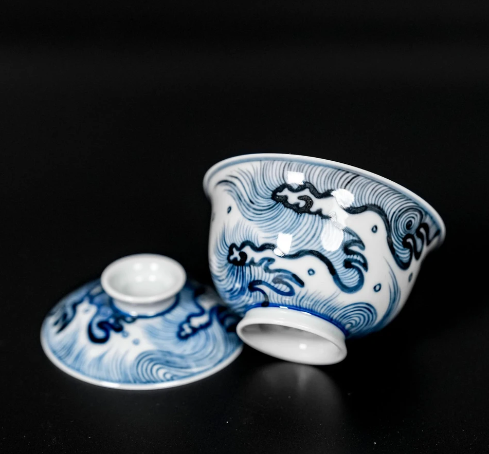 Ming dynasty inspired blue-and-white ceramic art featuring dynamic oceanic wave motifs