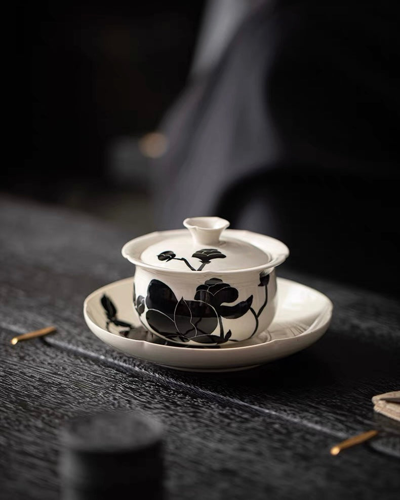 Minimalist magnolia gaiwan bowl with contrasting black floral pattern, ideal for oolong and white tea brewing