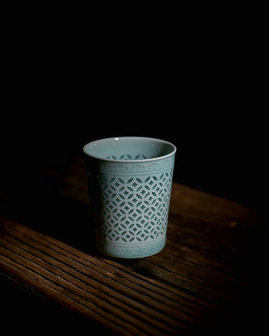 Minimalist oriental tea ware linglong celadon cup, jade cyan glazed hollow coin pattern ceramic drinking cup for tea lovers