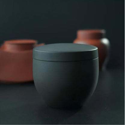 Traditional Yixing purple clay tea container with elegant retro style, perfect for travel and tea table decoration