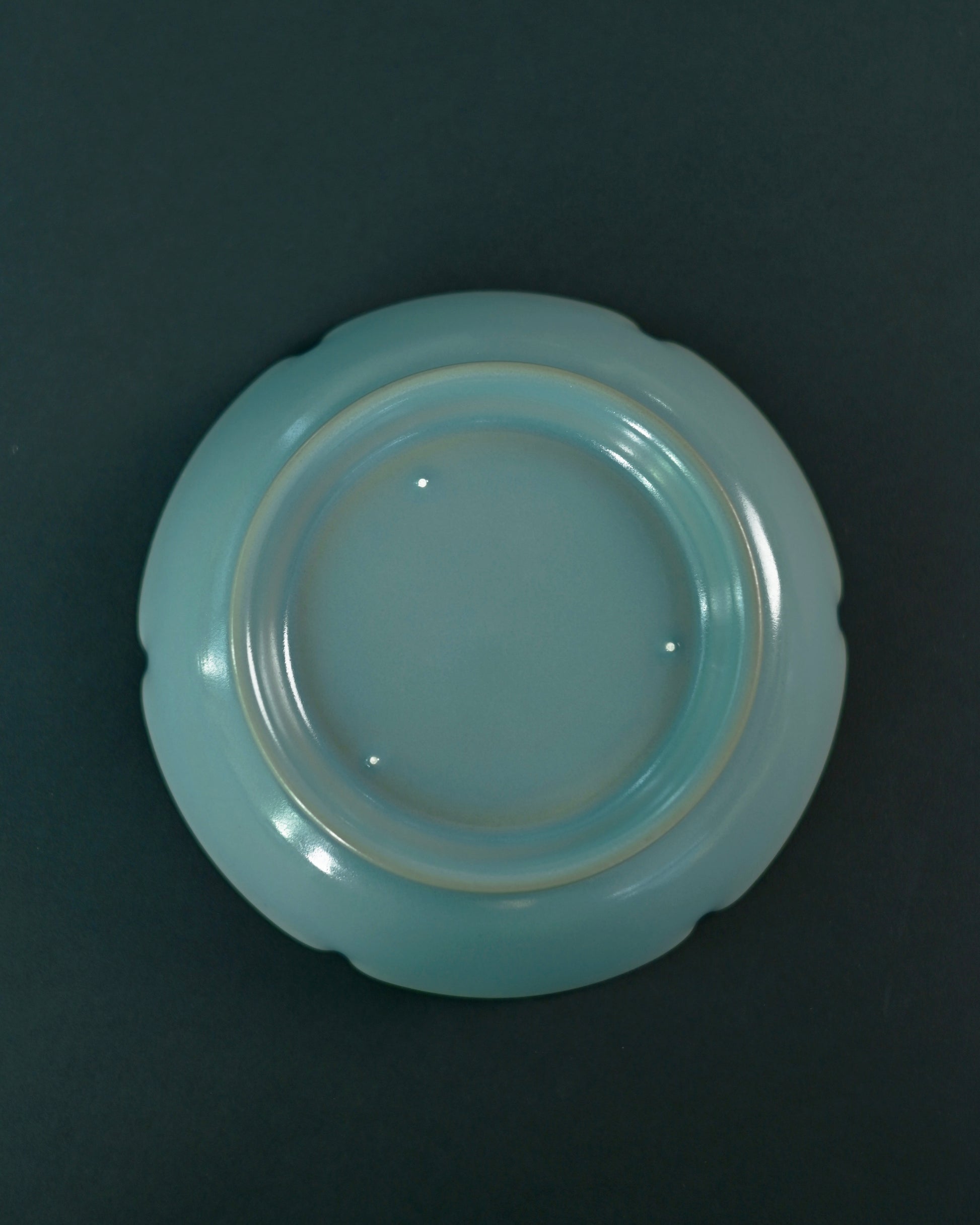 Multi-functional ceramic piece serving as brush washer, teapot drip tray, or dessert plate