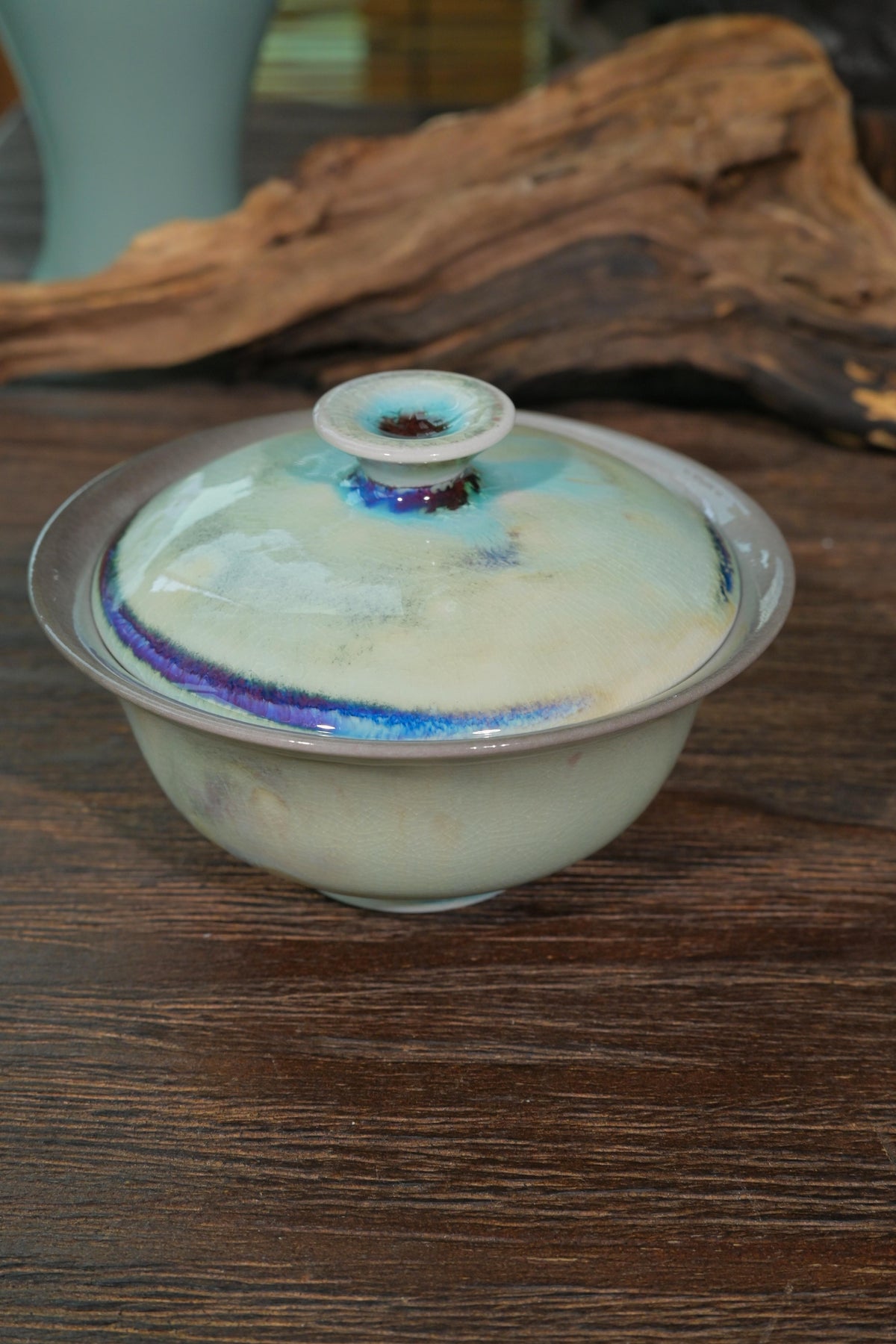 Close-up of 120ml wood-fired gaiwan wide Yuanbao lip and hollow lid knob designed for precise tea pouring