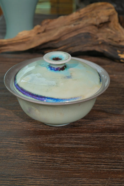 Close-up of 120ml wood-fired gaiwan wide Yuanbao lip and hollow lid knob designed for precise tea pouring