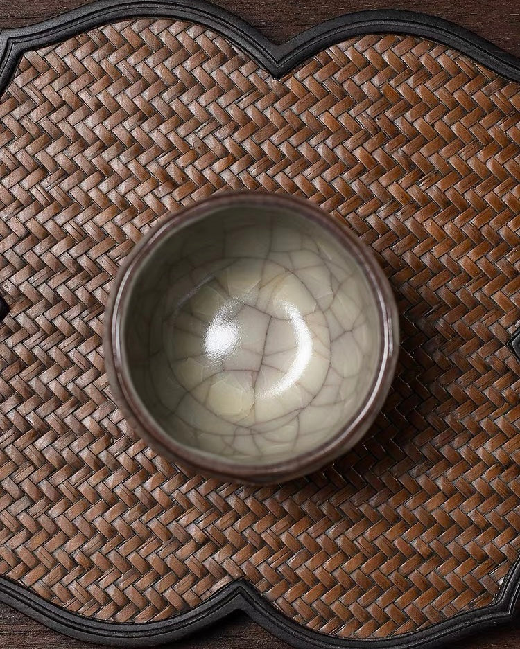 Oily lustrous celadon surface with thick unctuous quality and soft greasy sheen prized in Ge tradition