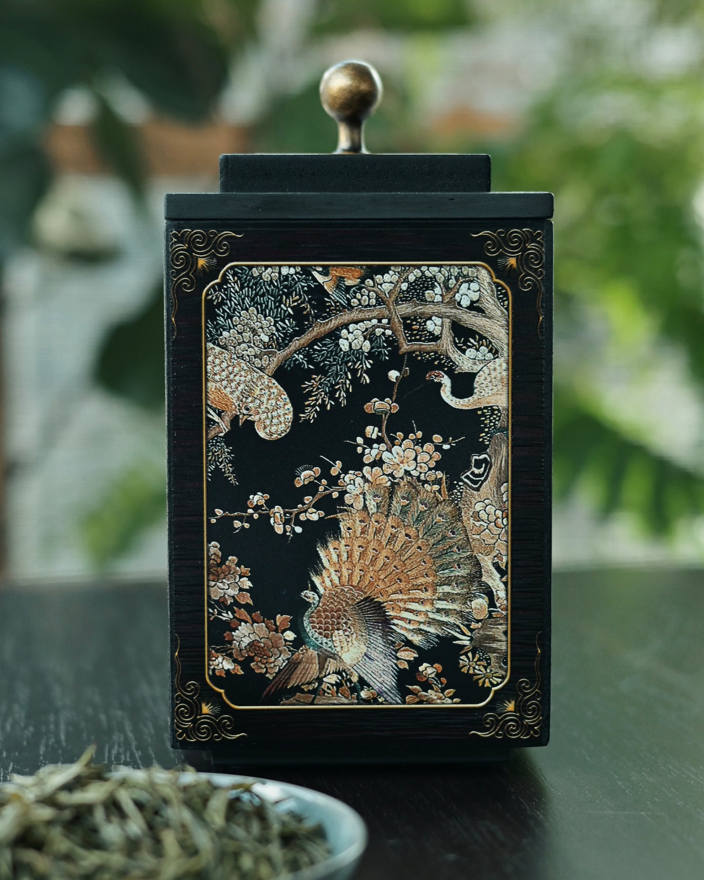 Anion-emitting bamboo charcoal tea canister with raised phoenix artwork, preserving tea freshness naturally