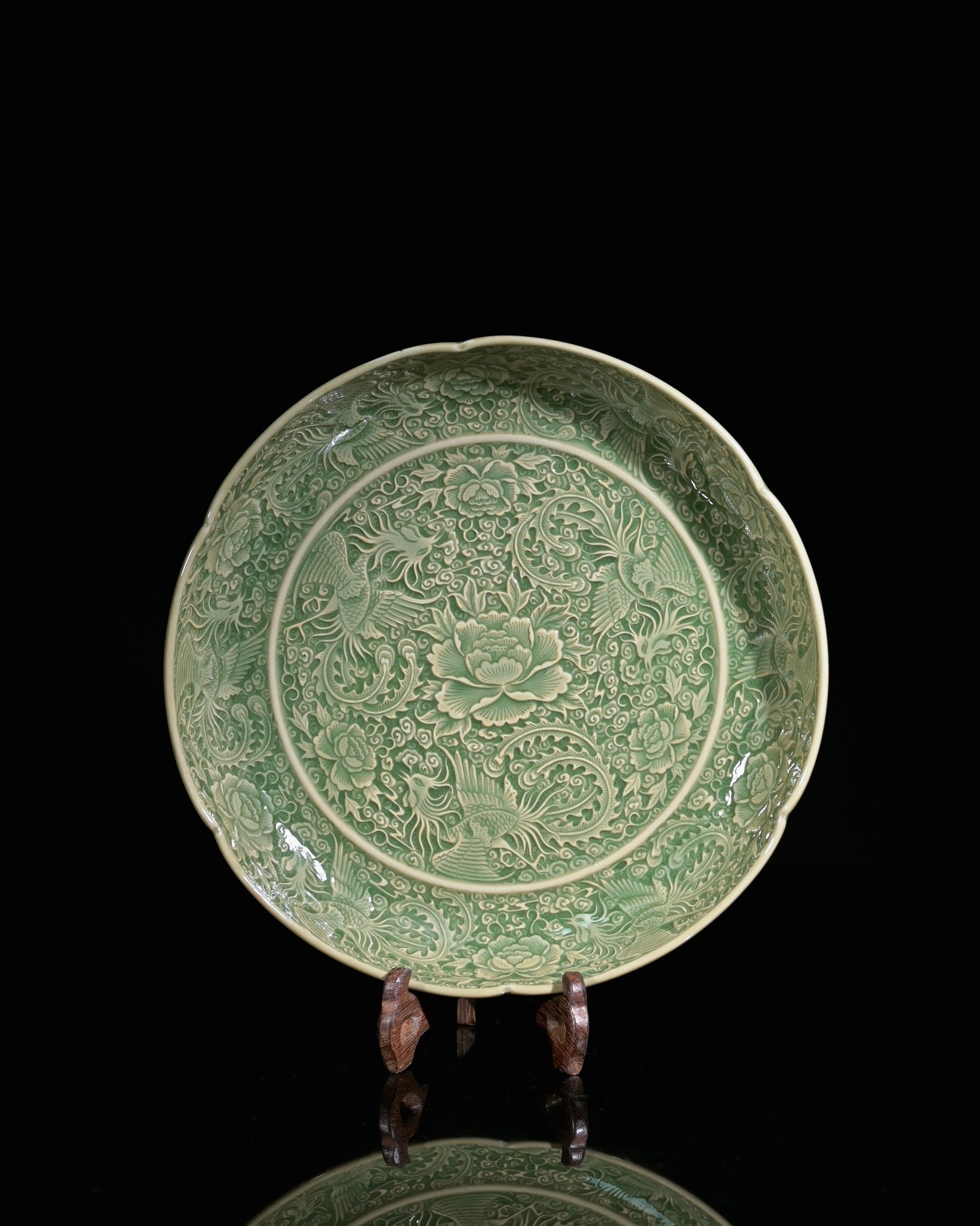 Phoenix as empress symbol and peony as flower king on olive-green glazed celadon dish