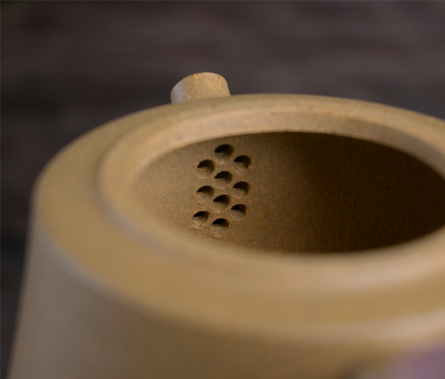 Collectible Pillar Base teapot with wider bottom and narrower top, resembling traditional architectural supports