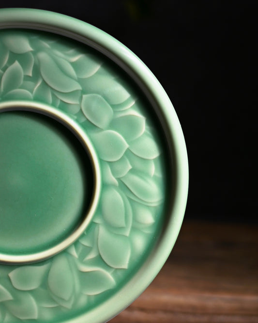 Vintage Song style plum jade green Longquan celadon teapot coaster with magnolia embossed pattern, premium tea table accessory