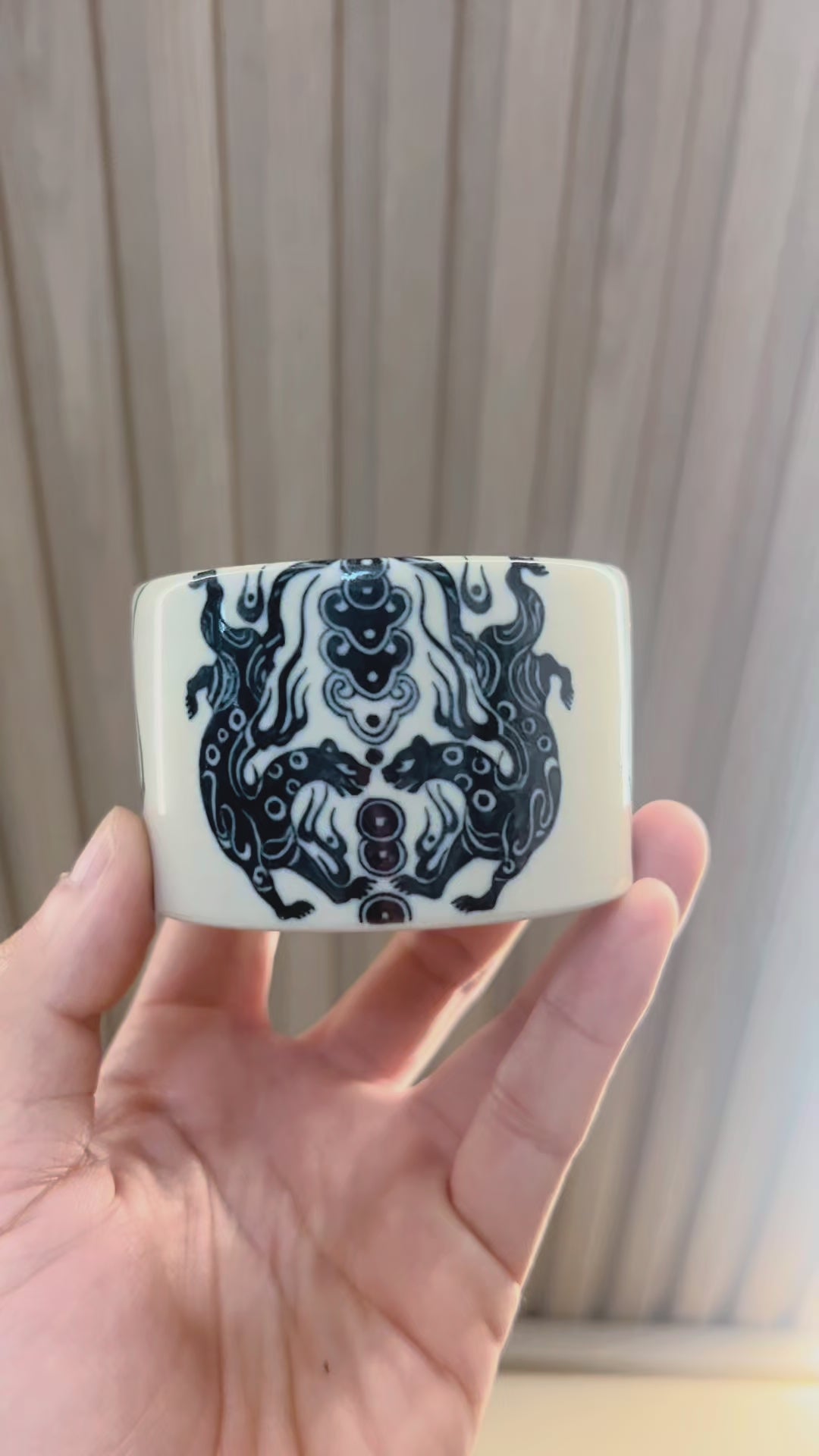Taoist elements integrated into ceramic 
 teacup design reflecting ancient charm-writing practices