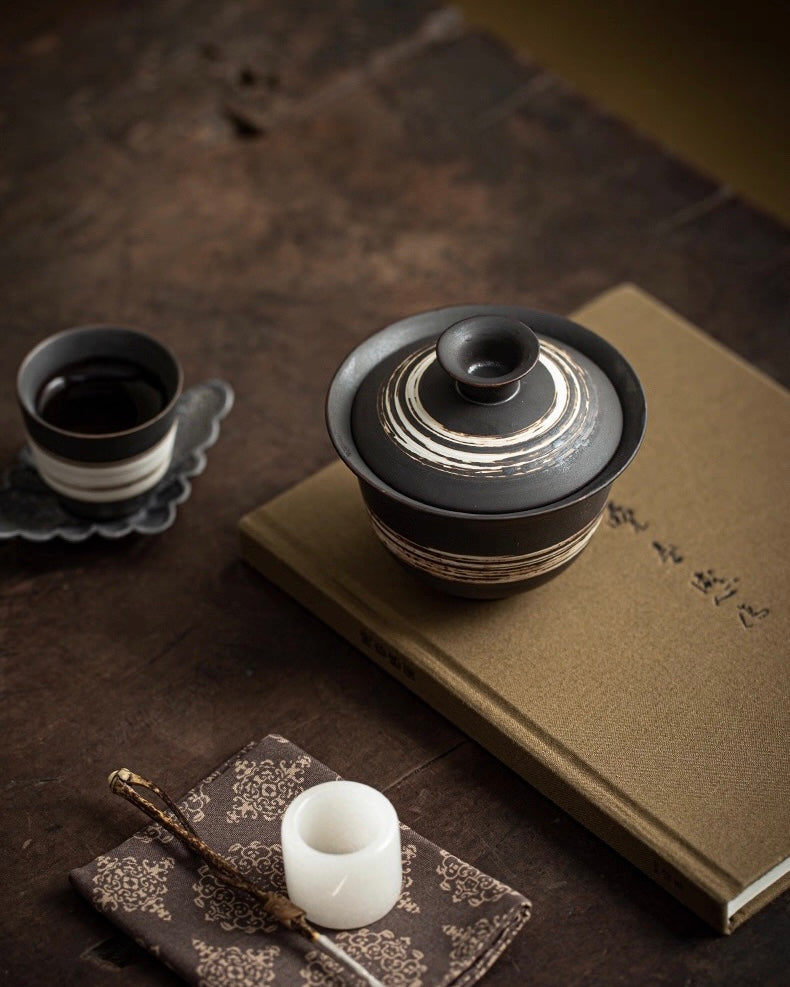 Raw clay tea set with slipware finish, embracing imperfect beauty for authentic tea experiences