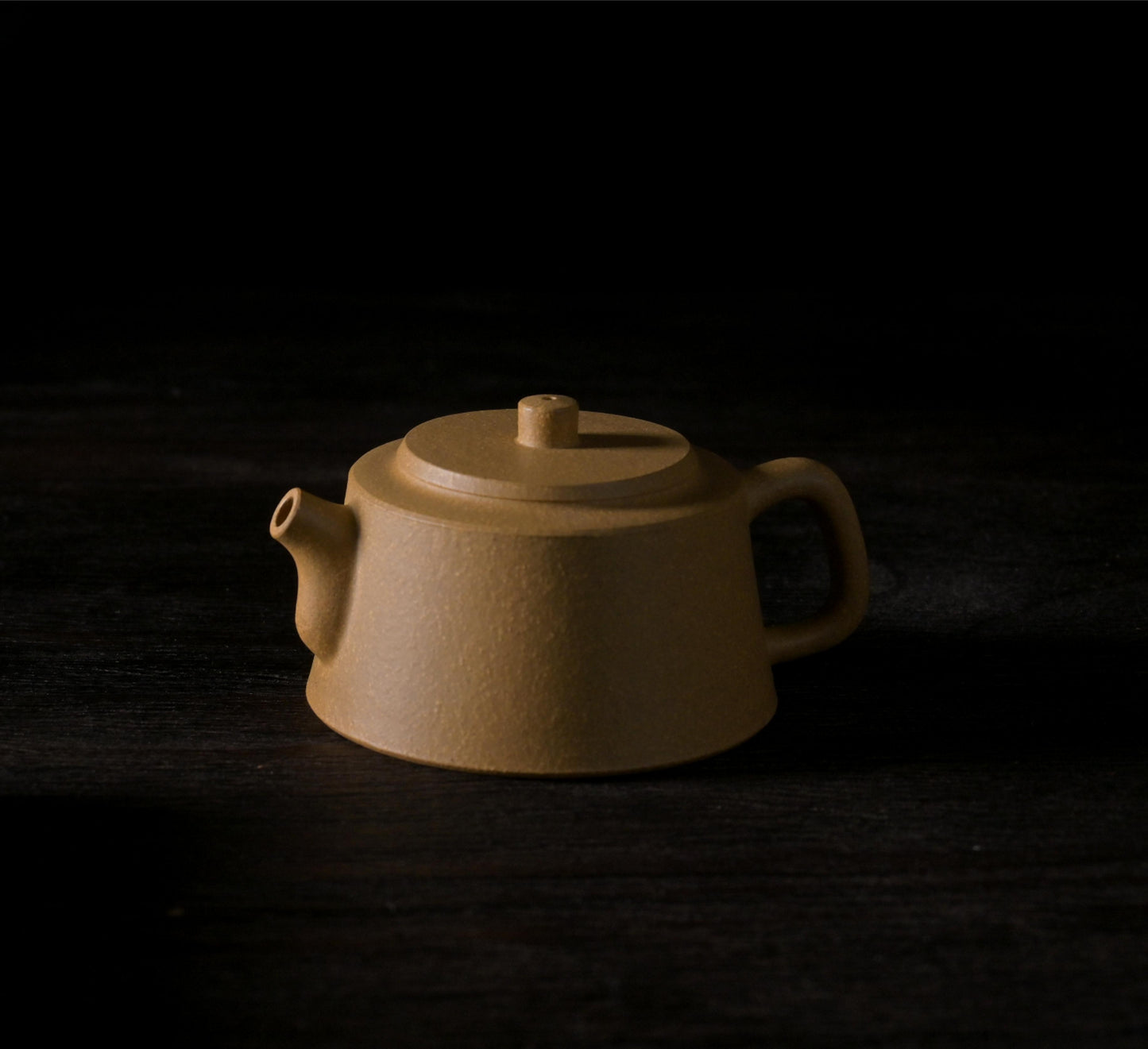 Semi-handmade purple clay teapot featuring textured yellow Duan clay surface and distinctive pillar base shape