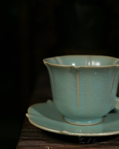 Ru‑celadon ceramic craft piece with elegant ornate curved handle, timeless Chinese hand‑made artware