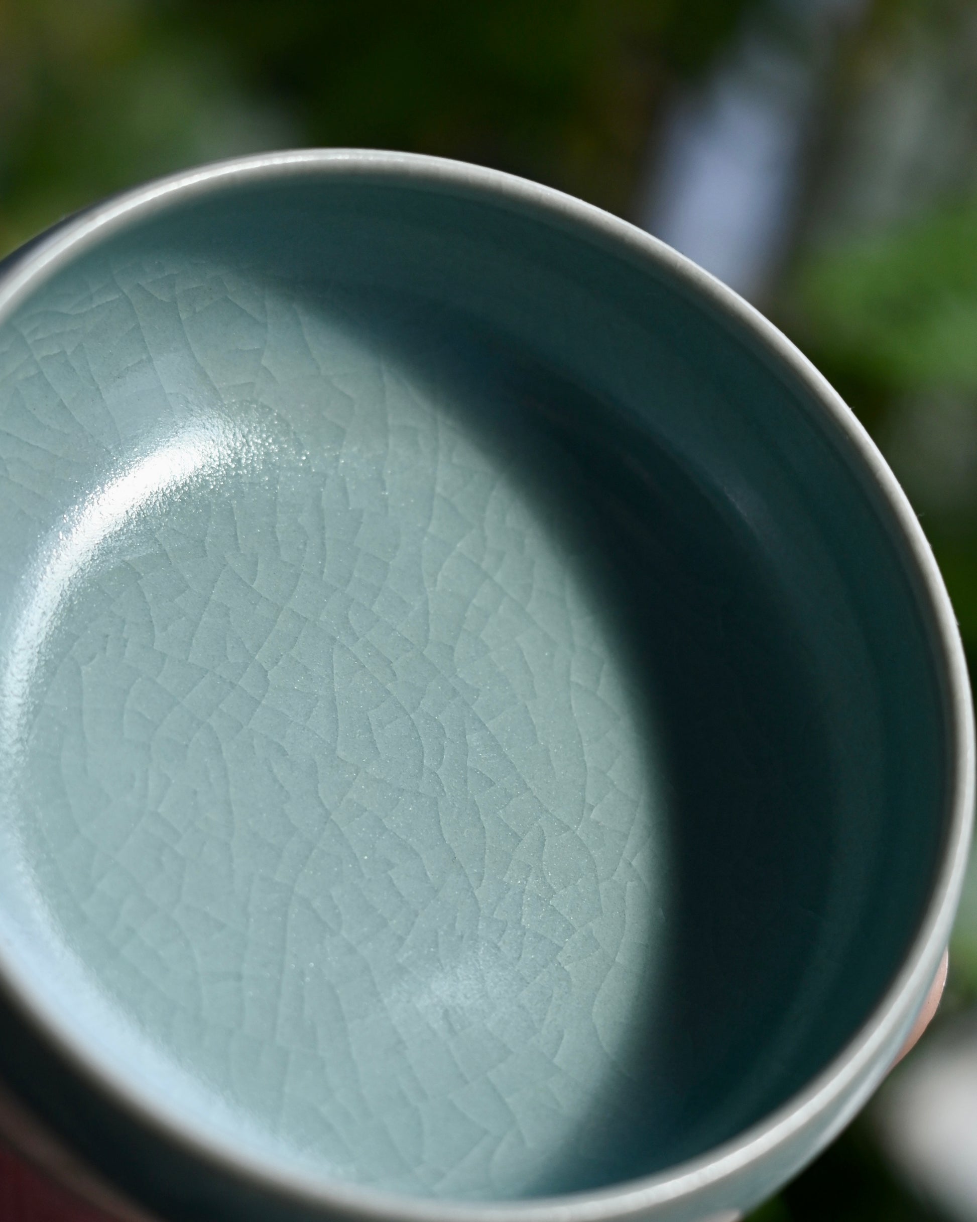 Ru ware dicada-wing crackle glaze pattern forming fine veining across the luminous celadon surface