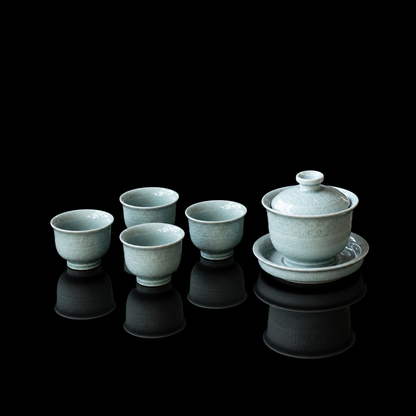 Close-up of the delicate relief pattern carved on the Ru Kiln powder-celadon porcelain tea set.