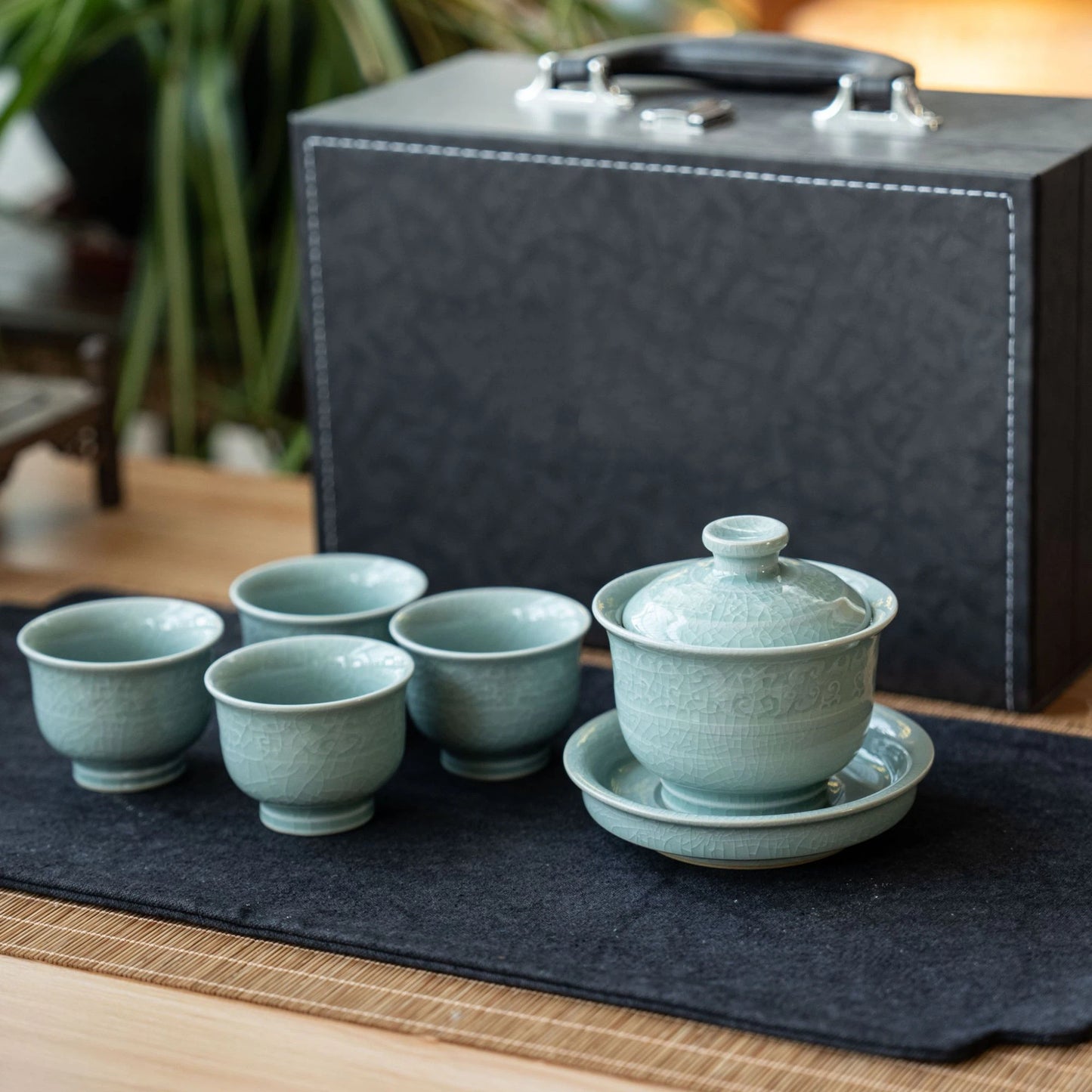 Ru Kiln Powder-Celadon "Relief Pattern" Crackle Porcelain Travel Tea Set full collection in a studio shot.
