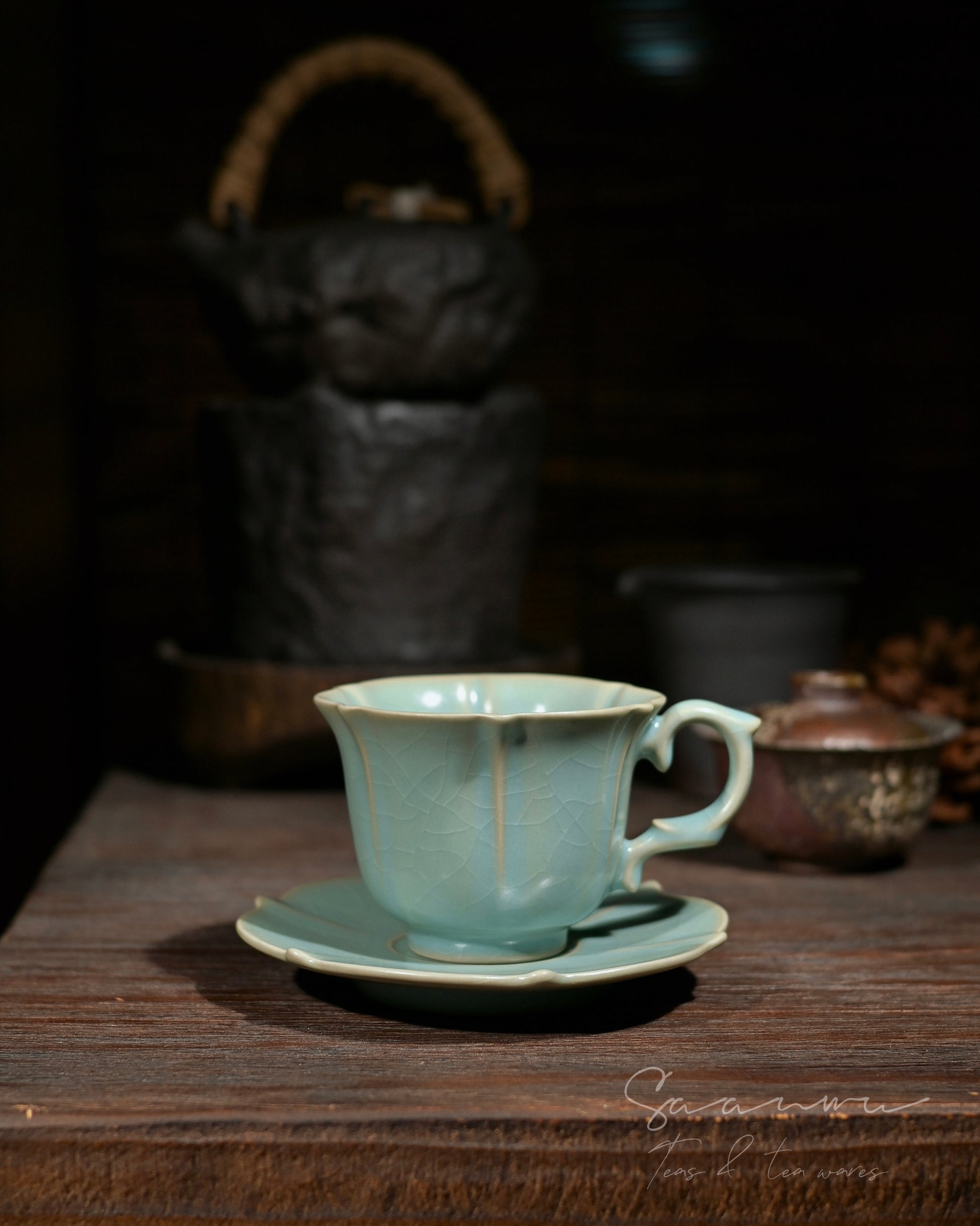 Collectible ceramic floral‑rim cup with soft shifting sky‑blue glaze, inspired by ancient Ru‑kiln aesthetics